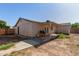 This backyard boasts a covered patio and grill, perfect for outdoor dining at 8051 W Mariposa Dr, Phoenix, AZ 85033