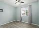 Bright bedroom with ceiling fan and a view, creating a calm retreat at 8051 W Mariposa Dr, Phoenix, AZ 85033