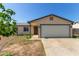 Charming single-story home featuring a neutral color palette, attached garage, and a low-maintenance front yard at 8051 W Mariposa Dr, Phoenix, AZ 85033