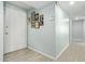 Inviting entryway with light-colored walls, decorative wall art, and neutral tiled floors leading into the home at 8051 W Mariposa Dr, Phoenix, AZ 85033