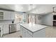 Updated kitchen with new cabinets, stainless steel appliances and central island at 8051 W Mariposa Dr, Phoenix, AZ 85033