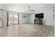 Bright living room with tile floors, a ceiling fan, and French doors leading to the outside at 8051 W Mariposa Dr, Phoenix, AZ 85033