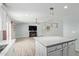 Open living space with modern light fixtures and tile flooring offers a welcoming and stylish design at 8051 W Mariposa Dr, Phoenix, AZ 85033