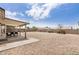 Expansive backyard featuring a covered patio, gravel landscaping, and privacy walls, perfect for outdoor enjoyment at 8103 E Dartmouth St, Mesa, AZ 85207