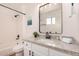 Bright bathroom features a granite vanity top and shower-tub combination at 8103 E Dartmouth St, Mesa, AZ 85207