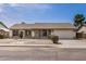 Well-maintained single-story home with a two-car garage and low-maintenance landscaping in front at 8103 E Dartmouth St, Mesa, AZ 85207