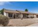 Well-maintained single-story home with a two-car garage and low-maintenance landscaping in front at 8103 E Dartmouth St, Mesa, AZ 85207