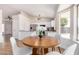 Open kitchen with a breakfast nook and ample natural light from large windows at 8103 E Dartmouth St, Mesa, AZ 85207