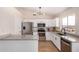 Modern kitchen features stainless steel appliances and granite countertops at 8103 E Dartmouth St, Mesa, AZ 85207