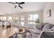 Open-concept living room flows into a dining area with backyard access at 8103 E Dartmouth St, Mesa, AZ 85207