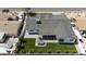 Aerial view of backyard featuring pool, putting green, BBQ island, outdoor living space, and perimeter wall at 8318 E Sells Dr, Scottsdale, AZ 85251