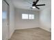 This bright bedroom features a modern ceiling fan and plantation shutters to filter the natural light at 8318 E Sells Dr, Scottsdale, AZ 85251