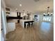 Open floor plan featuring kitchen with island, stainless appliances, hardwood floor, and living room at 8318 E Sells Dr, Scottsdale, AZ 85251