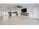 Open floor plan showcasing the living room and kitchen with an island, stainless steel appliances, and modern finishes at 8318 E Sells Dr, Scottsdale, AZ 85251