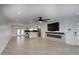Spacious living room with modern fireplace, open to the kitchen and dining area at 8318 E Sells Dr, Scottsdale, AZ 85251