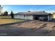 Charming single-story home with covered parking and well-maintained lawn at 834 E Lockwood St, Mesa, AZ 85203