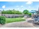 Lush backyard featuring a well-maintained lawn, patio area, and shaded seating perfect for outdoor enjoyment and entertaining at 907 E Kelsi Ave, San Tan Valley, AZ 85140