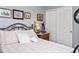 Comfortable bedroom with floral bedding, decorative side table, and closet providing storage and charm at 907 E Kelsi Ave, San Tan Valley, AZ 85140