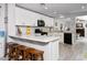 Bright kitchen boasts white cabinets, granite countertops, and stainless steel appliances at 907 E Kelsi Ave, San Tan Valley, AZ 85140