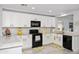 Bright kitchen featuring white cabinets, modern appliances, and a functional layout at 907 E Kelsi Ave, San Tan Valley, AZ 85140
