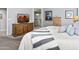 Bedroom view shows a dresser, television, and glass-enclosed shower at 907 E Kelsi Ave, San Tan Valley, AZ 85140