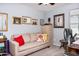 Comfortable room with soft couch, decorative pillows, and vintage décor creating a relaxing retreat at 907 E Kelsi Ave, San Tan Valley, AZ 85140