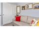 Inviting room with soft couch, decorative pillows, and vintage décor creating a relaxing retreat at 907 E Kelsi Ave, San Tan Valley, AZ 85140