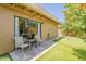 Patio features a putting green, outdoor chairs, and sliding glass door to home at 9196 E Evans Dr, Scottsdale, AZ 85260