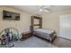 This neutral bedroom features a pull down bed with dark wood flooring and ceiling fan at 9196 E Evans Dr, Scottsdale, AZ 85260