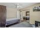 The bedroom features a murphy bed, ceiling fan, a sliding mirror closet and dark wood flooring at 9196 E Evans Dr, Scottsdale, AZ 85260
