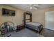 Bedroom featuring a modern murphy bed, wood floors, and a fitness corner at 9196 E Evans Dr, Scottsdale, AZ 85260