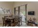Bright dining room with patio access, modern décor, and a stylish table perfect for entertaining at 9196 E Evans Dr, Scottsdale, AZ 85260
