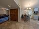 Welcoming entryway with wood double doors and an open view of the living spaces and kitchen at 9196 E Evans Dr, Scottsdale, AZ 85260