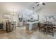 Open concept kitchen with light cabinets, stainless appliances, and wine storage at 9196 E Evans Dr, Scottsdale, AZ 85260