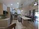 Bright, open kitchen featuring stainless steel appliances, modern countertops, and a breakfast bar at 9196 E Evans Dr, Scottsdale, AZ 85260