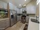 Modern kitchen with stainless steel appliances, stylish cabinets, and a clean countertop at 9196 E Evans Dr, Scottsdale, AZ 85260