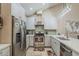 Updated kitchen featuring stainless steel appliances and neutral countertops at 9196 E Evans Dr, Scottsdale, AZ 85260