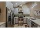 Well-lit kitchen with stainless steel appliances and modern cabinetry for a clean and functional space at 9196 E Evans Dr, Scottsdale, AZ 85260