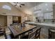 Open-concept kitchen and dining area featuring modern appliances, a spacious island, and vaulted ceiling at 9196 E Evans Dr, Scottsdale, AZ 85260