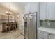 Kitchen with stainless steel appliances, light cabinets, and wine storage at 9196 E Evans Dr, Scottsdale, AZ 85260
