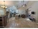 Spacious living room with high ceilings, dining area, and stainless steel appliances in the modern kitchen at 9196 E Evans Dr, Scottsdale, AZ 85260