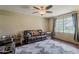 Comfortable living room featuring dark wood floors and large window at 9196 E Evans Dr, Scottsdale, AZ 85260