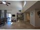 Spacious living room featuring high ceilings, a ceiling fan, and access to the patio at 9196 E Evans Dr, Scottsdale, AZ 85260