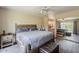 Serene main bedroom with a cozy rug, dark wood floors, and ensuite access mirrored in a sliding closet door at 9196 E Evans Dr, Scottsdale, AZ 85260