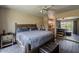 Bedroom with a king-size bed, sliding mirror closet doors, and views of the outdoor patio at 9196 E Evans Dr, Scottsdale, AZ 85260