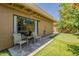 The backyard patio has two chairs, a table, and a putting green at 9196 E Evans Dr, Scottsdale, AZ 85260