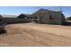 Backyard and home construction featuring scaffolding and plenty of space at 9531 W Parkway Dr, Tolleson, AZ 85353