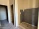 Bathroom with shower stall and door frames ready for customization at 9531 W Parkway Dr, Tolleson, AZ 85353