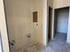 Bathroom corner showcasing plumbing fixtures and doorframe, ready for customization at 9531 W Parkway Dr, Tolleson, AZ 85353