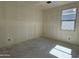 A spacious new bedroom featuring fresh walls, a window for natural light, and modern electrical outlets at 9531 W Parkway Dr, Tolleson, AZ 85353